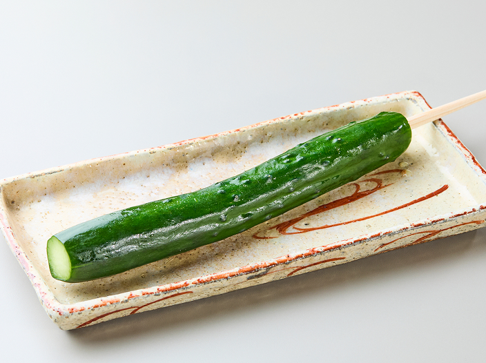 Chilled pickled cucumber on a stick